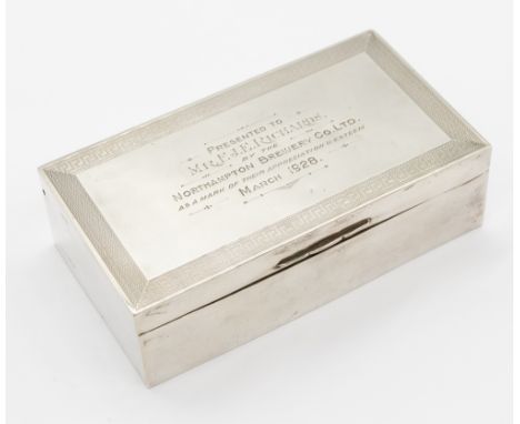 A George V silver and cedar wood rectangular cigarette box, two compartments within and the hinged cover with Greek Key engin