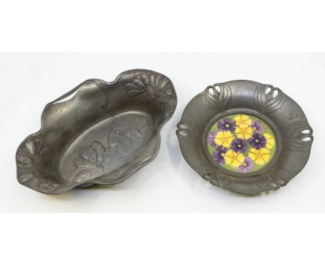 An early 20th Century 'Orivit' pewter Art Nouveau stylised designed bowl, with a floral designed circular ceramic centre, the