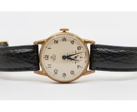 A gents vintage 9ct gold 'Smiths De Luxe' 15 jewel wristwatch, comprising a round signed silvered dial with applied gilt Arab