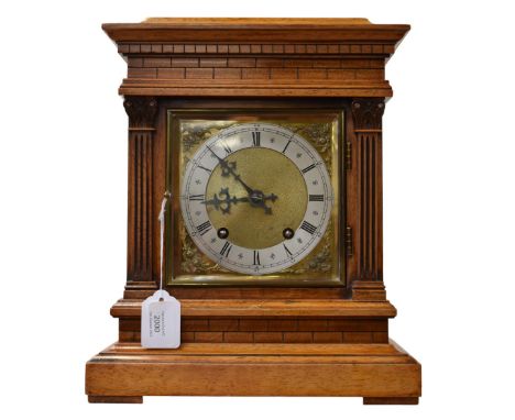 A 20th century cased bracket/mantel clock with brass detail.