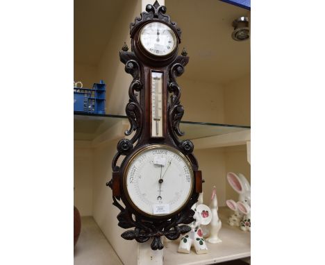 Late 19th century carved oak wall barometer and 8 day clock combined by Schwerer&nbsp;of Truro&nbsp;