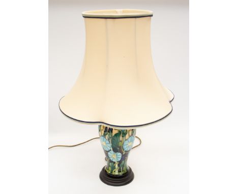 Moorcroft Pottery - A 21st century lamp decorated in blue "Morning Glory" floral design, on circular wooden base, together wi