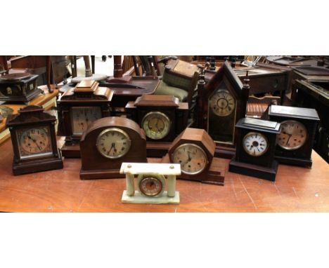 A collection of early 20th century mantel clocks, mostly German, 8-day, together with a mid 20th century onyx mantel clock (9