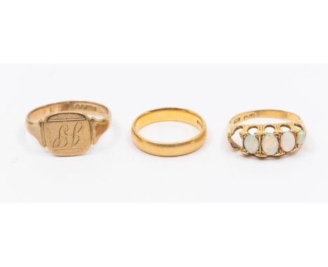 A collection of gold rings to include a 22ct gold band, size N, weight approx 4.3gms along with a opal set 18ct gold ring ( o