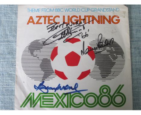 1986 WORLD CUP THEME RECORD COVER SIGNED BY BOBBY MOORE, GEOFF HURST &amp; MARTIN PETERS
&nbsp;Nice item of memorabilia with 