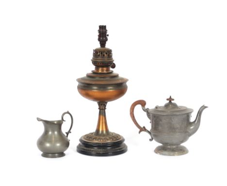 An oxidised Copper Veritas oil lamp;&nbsp;a spot hammered pewter teapot; and a pewter jug