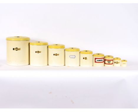 A set of nine Garrison enamel storage tins