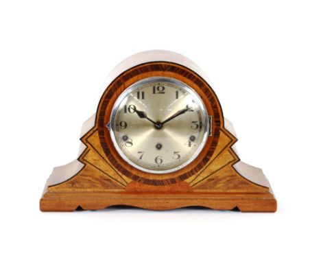 An Art Deco walnut and inlaid chiming mantel clock