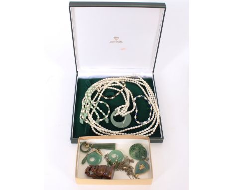 A pearl multi strand necklace; various jade pendants etc.