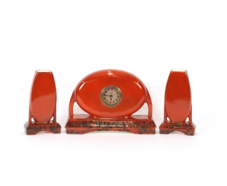 A modernist ceramic clock garniture, stamped M.W. Wasmule