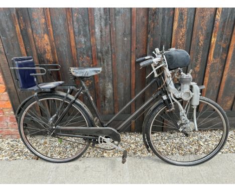 A Dawes bicycle with fitted rear child seat, 49cc mini-mag motor engine, engine no. 51/0/26G. 