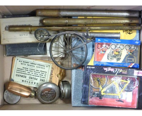 A box of cycling ephemera inc. Tour de France models, expanding cups, tobacco flask, boxed set of cycling spoons, brass pneum