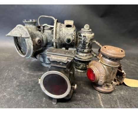 Four lamps: rear paraffin lamp, Lucas Model 143 carbide lamp, H. Miller &amp; Co. 'Lumo' rear lamp and a Jos. Lucas carbide. 