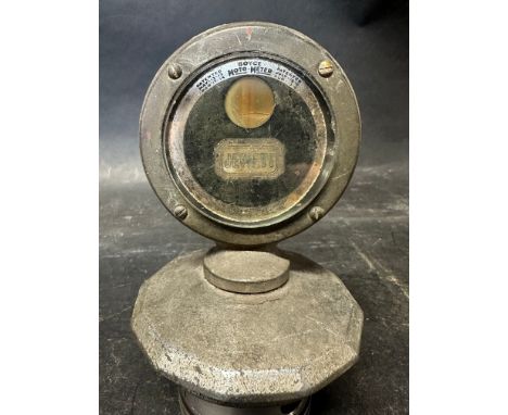 A Jewett Boyce meter on radiator cap, mounted upon a piston. 