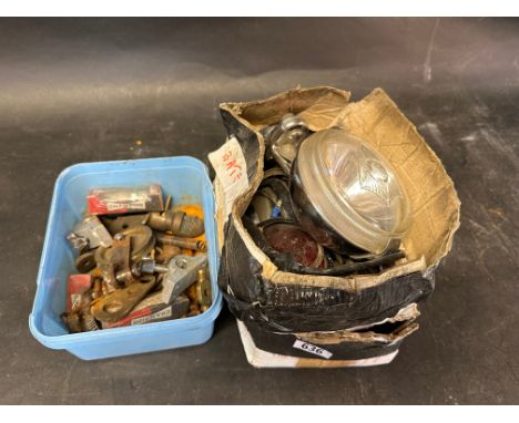 A Wipac spot light and five rear lights in need of refurbishment along with a box of misc items inc Champion J8 sparkplugs (4