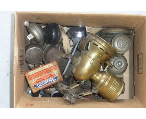 A box of bicycle bells and bicycle lighting. 