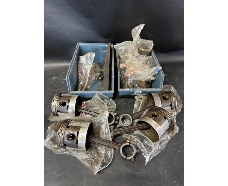 Four conrods and pistons and various other engine parts. 