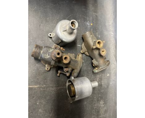 A pair of bronze carburettor 1 1/4" bodies and two bronze pistons and pots, horizontal flange etc. 