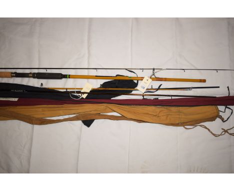 An Abu Atlantic 1182 8 1/2ft. light/medium action spinning rod with matching slip, together with; a Ron Thompson Highlander 8