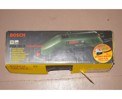 A Bosch PDA120E electric delta sander in original box.