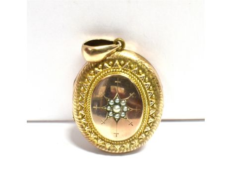 LARGE CIRCA 1900 LOCKET The locket star set to the front with a seed pearl flower, in a 9ct gold central oval panel with the 
