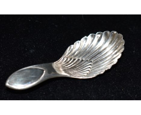A SILVER CADDY SPOON Hallmarked for Sheffield, date letter W, maker T.B &amp; S, length 8.5cm