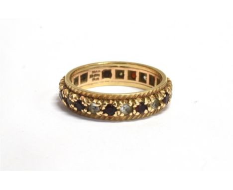 A MARKED 375 GOSHENITE AND RUBY PASTE SET ETERNITY RING Band width 5mm, size N, weight 3.3g