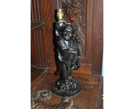 A carved Rootman lamp.