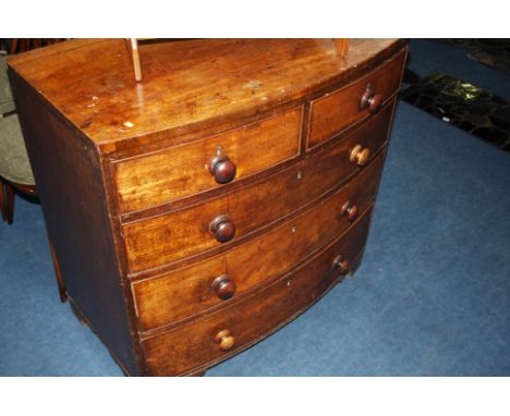 A Victorian mahogany bow front chest of drawers with two short and three long graduated drawers, supported on bracket feet.  