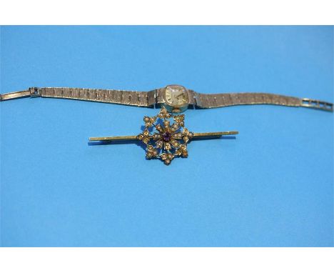 A 9ct ladies Rotary watch and a seed pearl brooch.