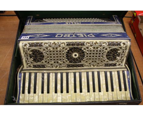 A Pietro accordion and case.