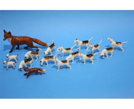 Two Beswick foxes and a collection of Hunting dogs.