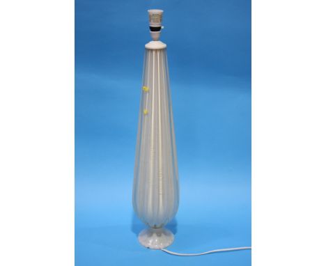 An Italian glass table lamp with opaque white glass and gold speckles.