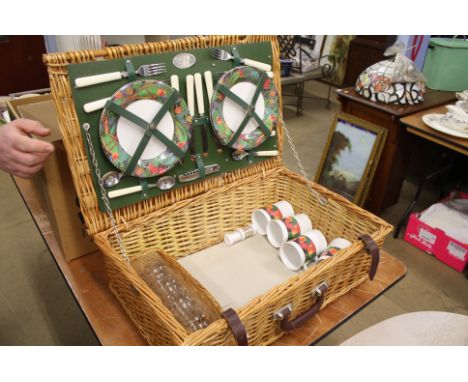 A Wicker hamper and fitted contents.