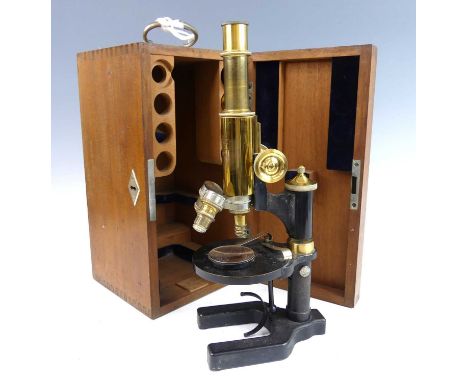 A Carl Zeiss Jena lacquered brass and iron monocular microscope, No.55392, in fitted mahogany case with two brass and one met