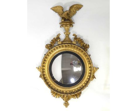 A mid-19th century giltwood and gesso girandole, the convex mirrorplate within a reeded ebonised slip and further boulle appl