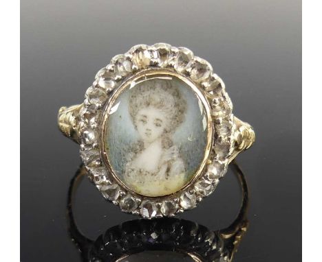 A George III yellow and white metal miniature portrait on ivory and diamond oval cluster ring, depicting a lady within a bord
