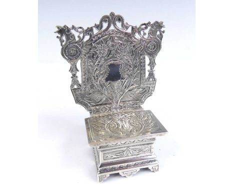 A 19th century Russian silver salt throne, the elaborately chased and pierced high-back decorated with floral sprays, scrolls
