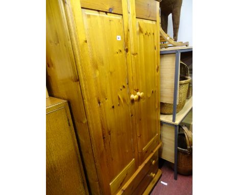 Modern pine two door wardrobe with two base drawers and a small pine bedside cabinet