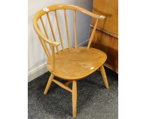 An Ercol 451 Cowhorn design, blonde fireside chair, blue label