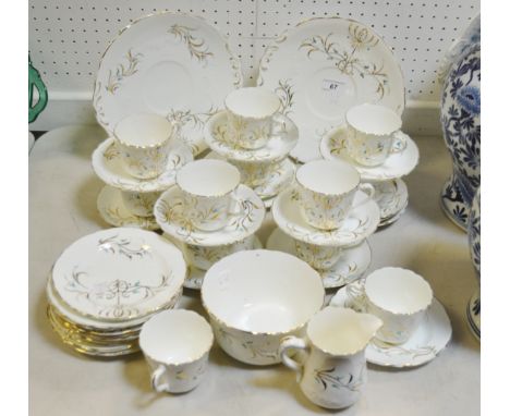 A Victorian tea service for twelve, moulded and painted with flowers, gilt highlights, pattern No 1391, c.1880