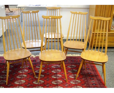 A set of six high back Ercol Goldsmith design , blonde  dining chairs, shaped cresting rail, blue label