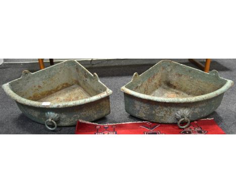 Architectural salvage - a pair of iron corner feed troughs
