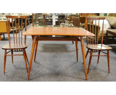 An early Ercol pattern design 393 breakfast table, rounded rectangular surface above stylish magazine rack, slim splayed and 