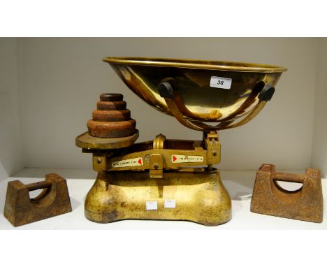 A late 19th century/early 20th century brass pan scales with stacking 7lb and 14lb weights
