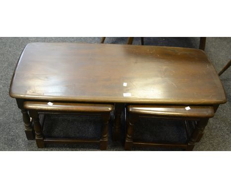 A nest of three Ercol dark oak occasional tables