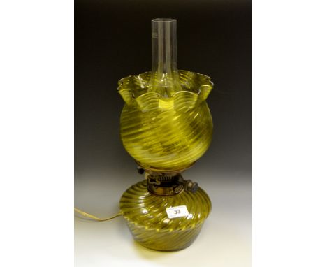 A Victorian glass oil lamp, converted to electricity, green glass shade c 1890