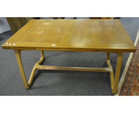 An early Ercol 519 pattern design dropleaf draw leaf dining table, splayed legs, shaped supports, refectory stretcher, produc