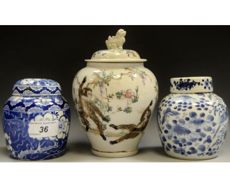 A late 19th early 20th century oriental baluster ginger jar and cover, Dog of Fo finial, hand painted scene of 2 dancing monk