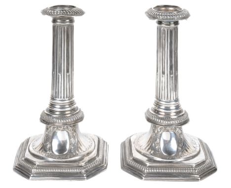 A Pair of Queen Anne Period Candlesticks:In traditional period form with column top and cartouche to the base, sounded by sca